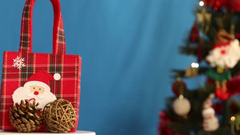 christmas present rotating in front of the tree