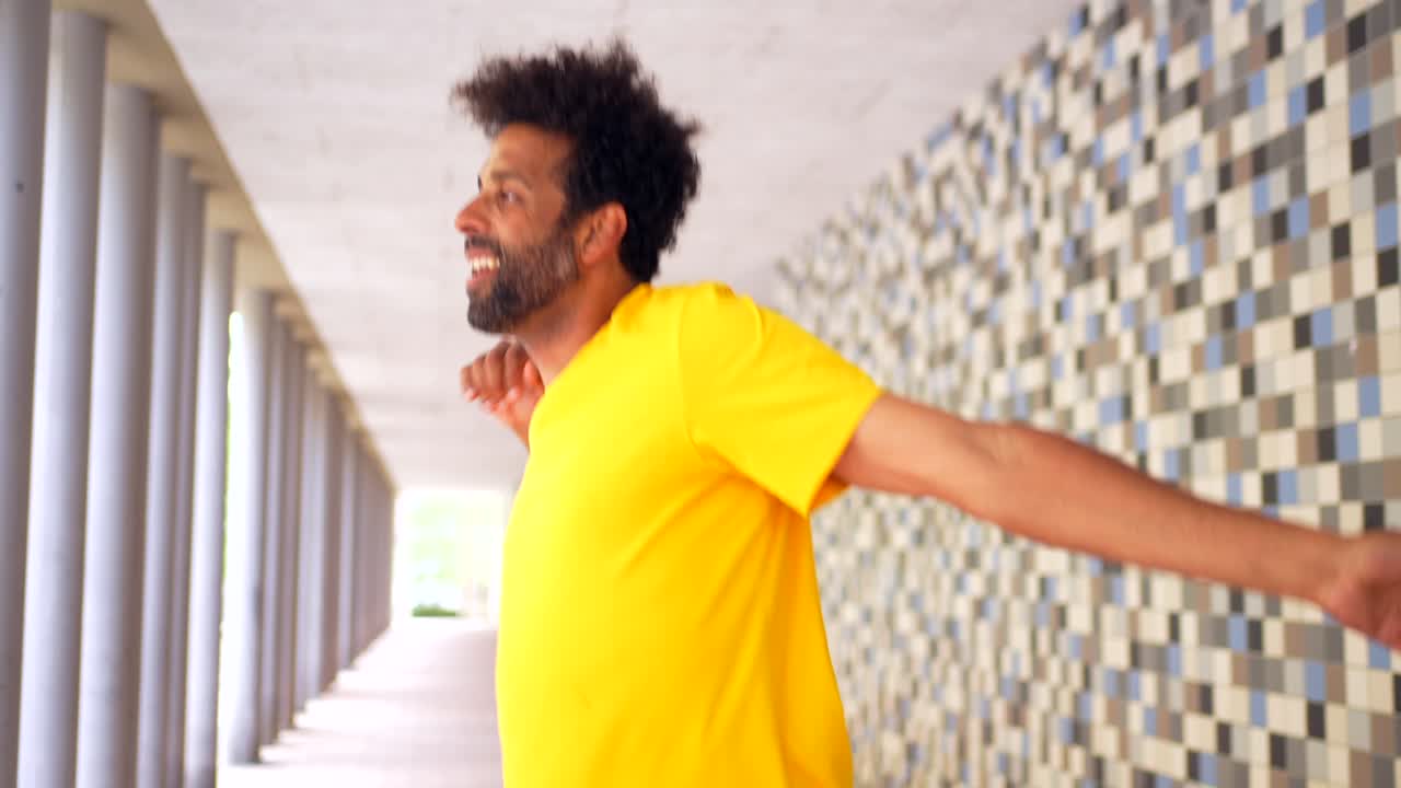Man dancing in a tunnel