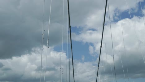 steel cables and sky view from humber bridge in hessle on a cloudy day, slow motion