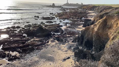 Pan-tilt-shot-of-the-Pacific-Ocean-and-Pigeon-Point-Lighthouse-on-a-Sunny-Day-in-Northern-California