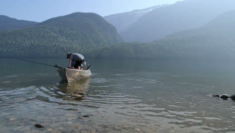 Two-fishermen-preparing-for-fishing-at-countryside-4k