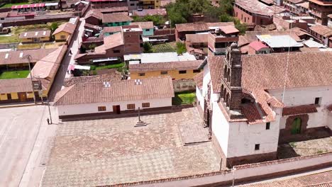 san pedro apóstol church in andahuaylillas, cusco with rooftops surrounding it