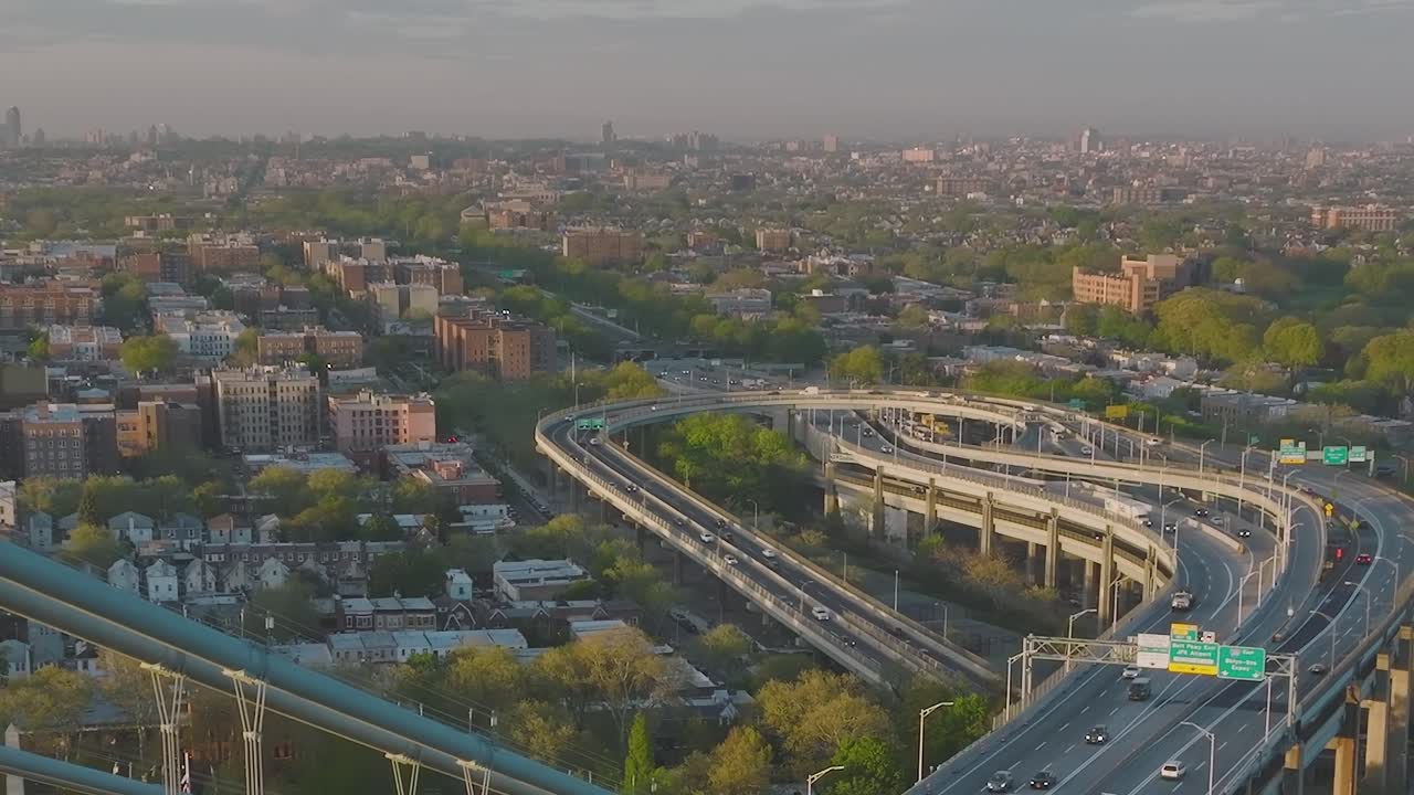 Aerial view of a cityscape with highways and buildings