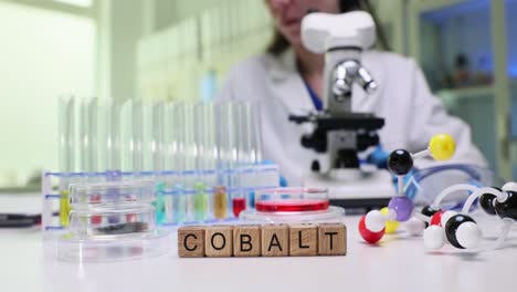 scientist working with cobalt in a chemistry laboratory