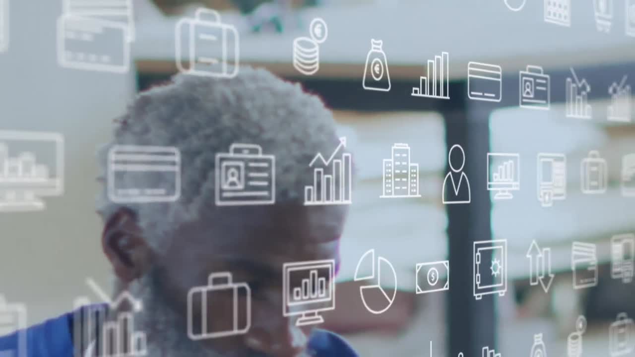 animación de varios iconos de inversión contra el hombre maduro africano que trabaja en el taller