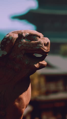 close-up of a stone lion at a japanese temple