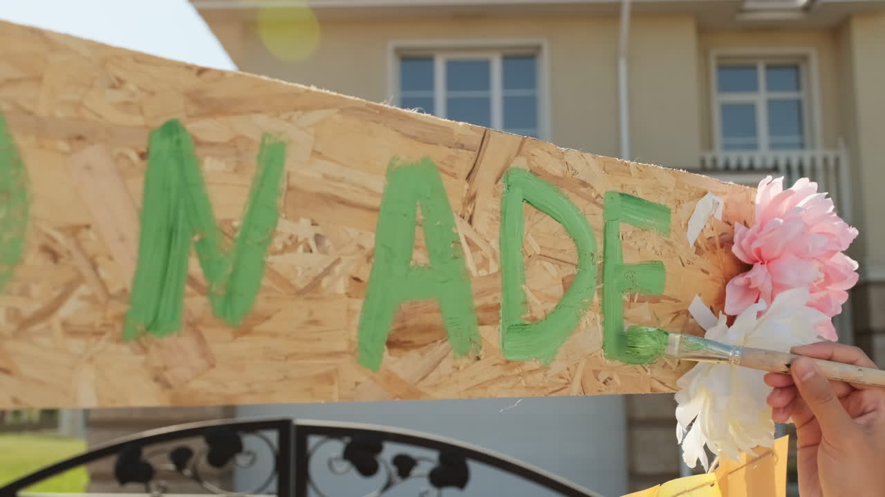 Writing Title On DIY Wooden Lemonade Stand