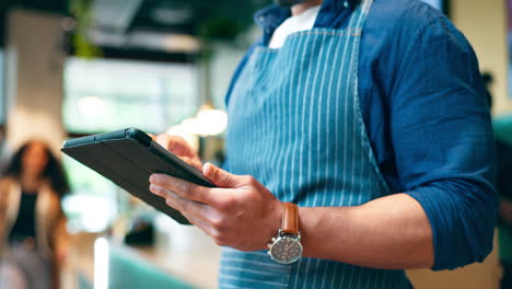 business owner, hands and tablet for cafe