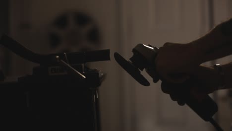 close backlighting shot of a grinding disc working on metal and many sparks coming out of it