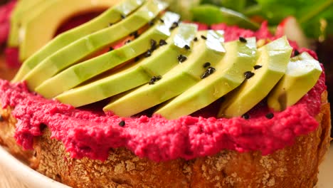vibrant avocado and beetroot hummus toast