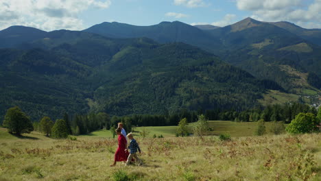 family walking beautiful landscape background with green forest hills pikes