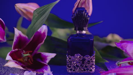 close-up zoom in to a vintage blue fragrance bottle