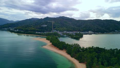 aerial view of a beautiful island with sandy beach and lush green coastline