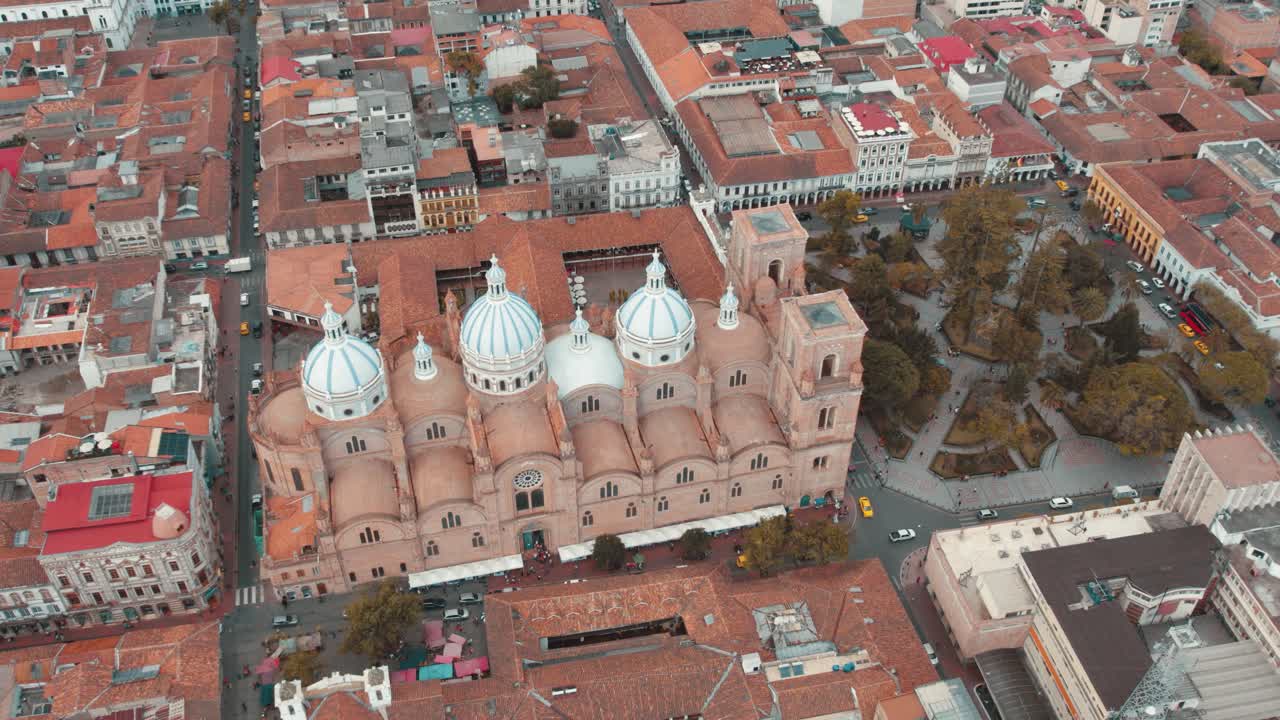 A breathtaking aerial view of Cuenca, Ecuador! Marvel at its historic charm, red-tiled roofs, and stunning Andean backdrop, showcasing the perfect blend of tradition and natural beauty