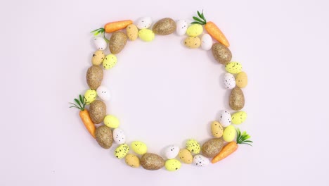 happy easter write on paper surrounded with eggs frame. stop motion