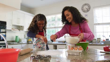 family making christmas cookies at home