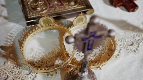 Orthodox-wedding-crowns-and-cross,-religious-items-for-ceremony