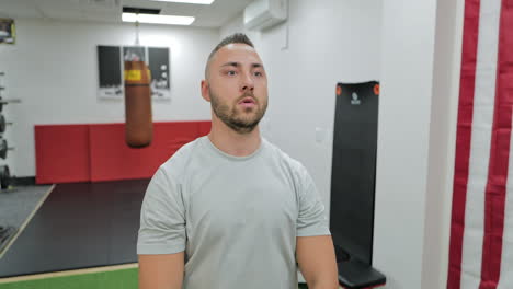 muscular man actively training in the modern gym