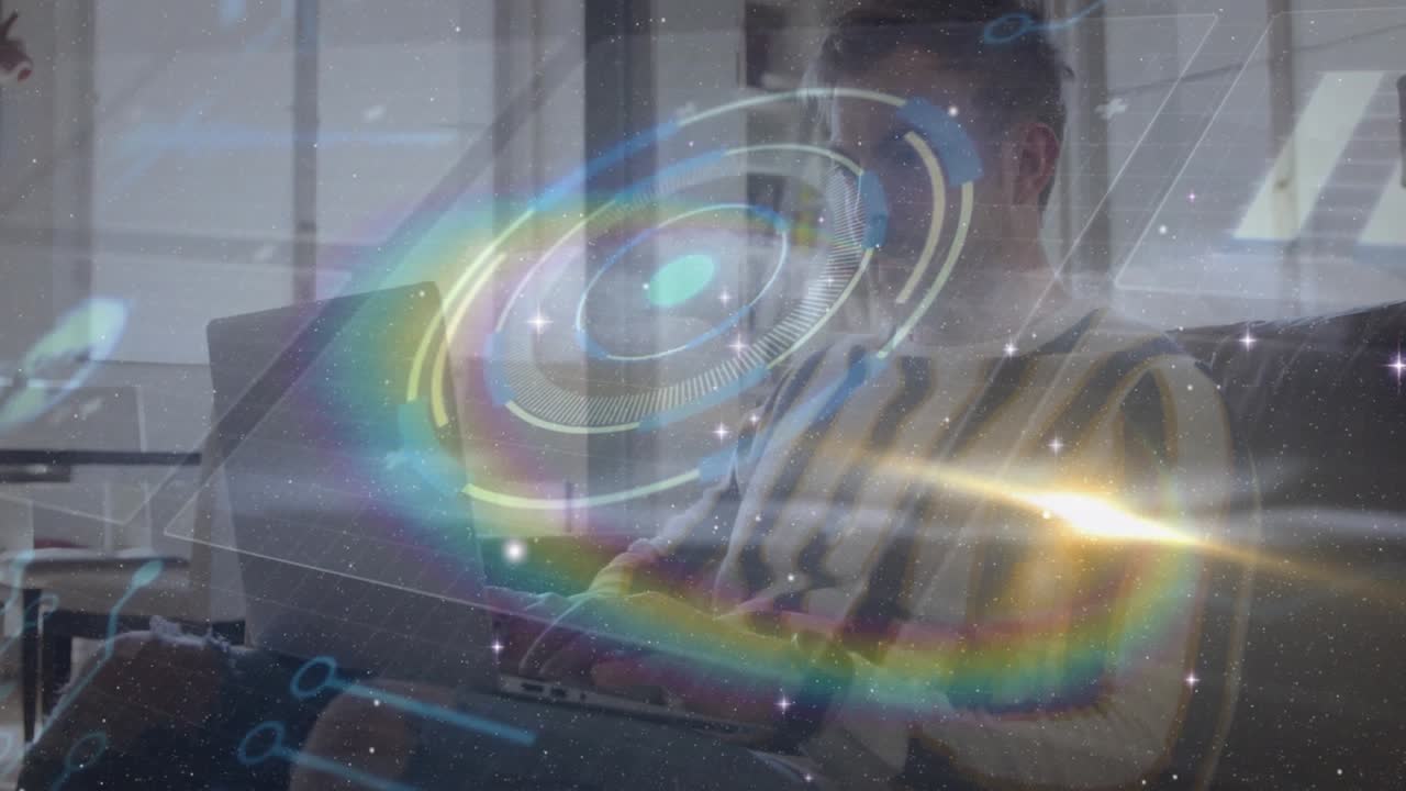 Man typing on laptop in home lounge, initiating holographic rings swirling into tech interface demo