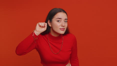 a young woman in a red shirt smiles at the camera