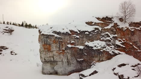 snowy mountain cliff with people