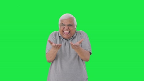 Happy-Indian-old-man-making-fun-of-somebody-Green-screen