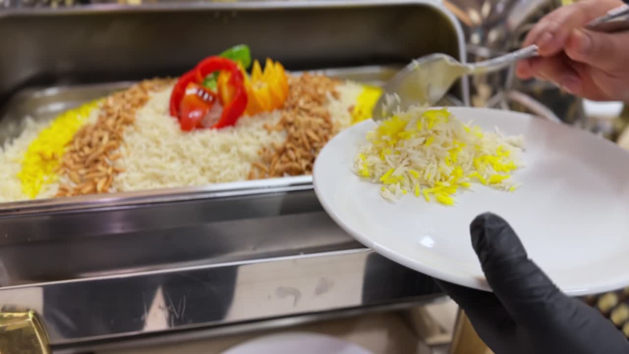 Serving Arabic Rice with Nuts and Peppers at Buffet – 4K Traditional Cuisine Footage
