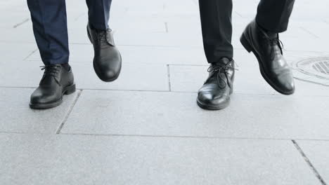 Business-partners-going-for-job-in-morning.-Businessmen-walking-on-urban-street