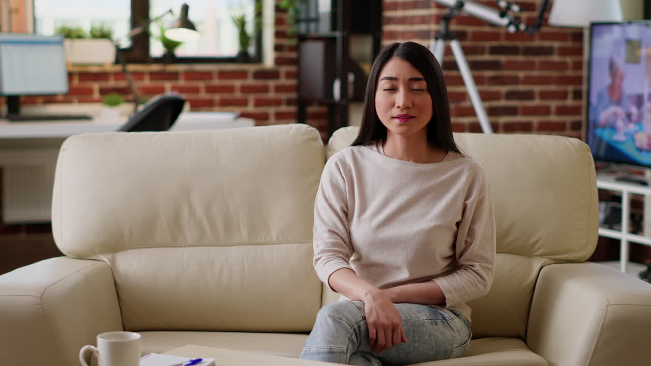 Asian woman in living room