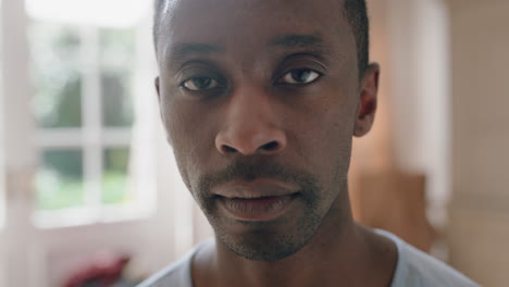 portrait young african american man with serious expression looking at camera