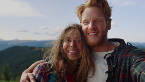 Tourists-talking-by-video-chat-in-mountains