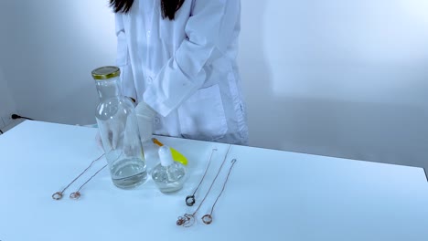 scientist conducting experiment with glass bottles and tools