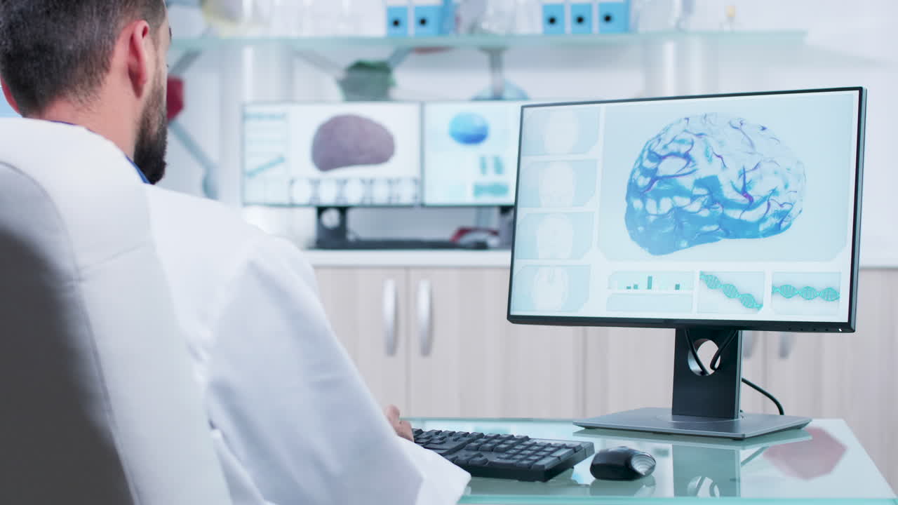 Doctor analyzing brain scan on computer