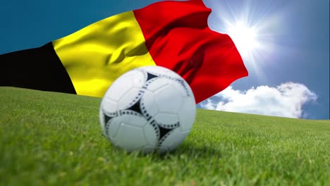 animation of flag of belgium over football on stadium