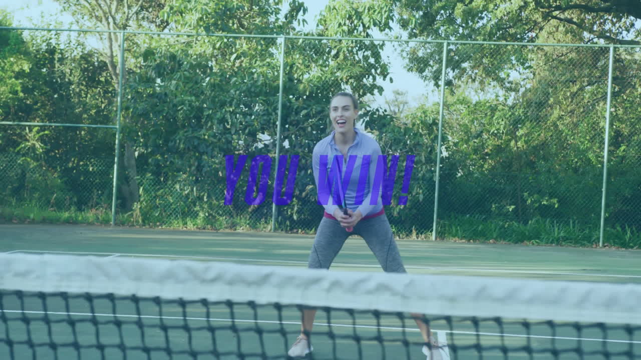 Female tennis player holding racket behind net on court, displaying animated sports YOU WIN overlay