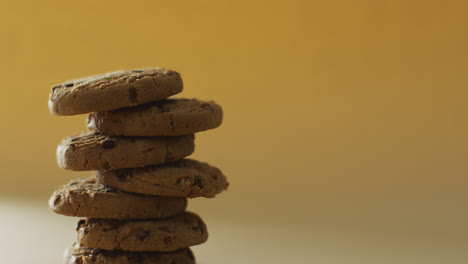 video of biscuits with chocolate on yellow background