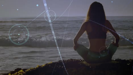 animation of networks of connections over caucasian woman praciticing yoga on beach