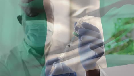 animación de la bandera de nigeria ondeando sobre el médico con máscara facial y con la vacuna en la mano