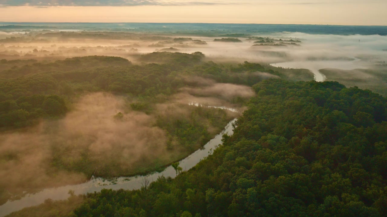 A peaceful foggy morning captured by a drone flying above the Huron River in Milford, Michigan.