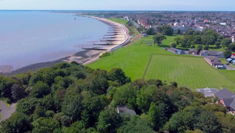 aerial view of a coastal town with beach and park