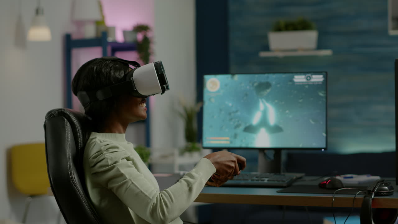 Black woman gamer playing video game at powerful computer using VR