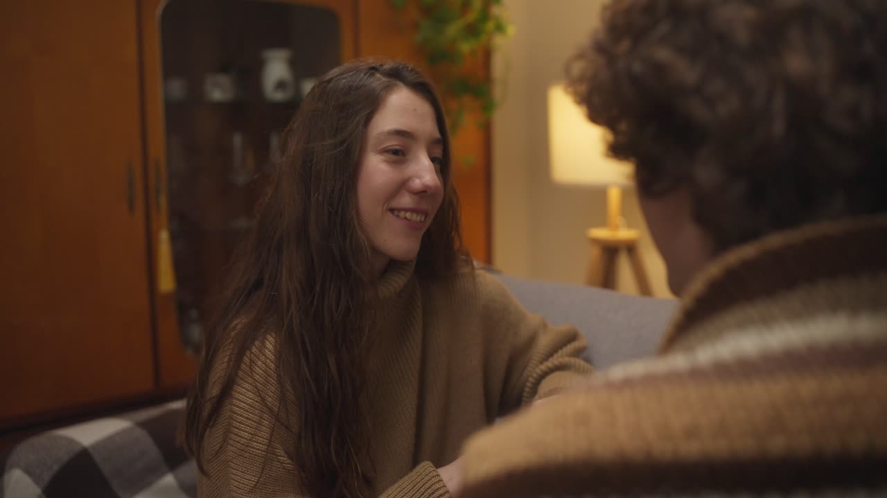 Couple having a conversation in the living room