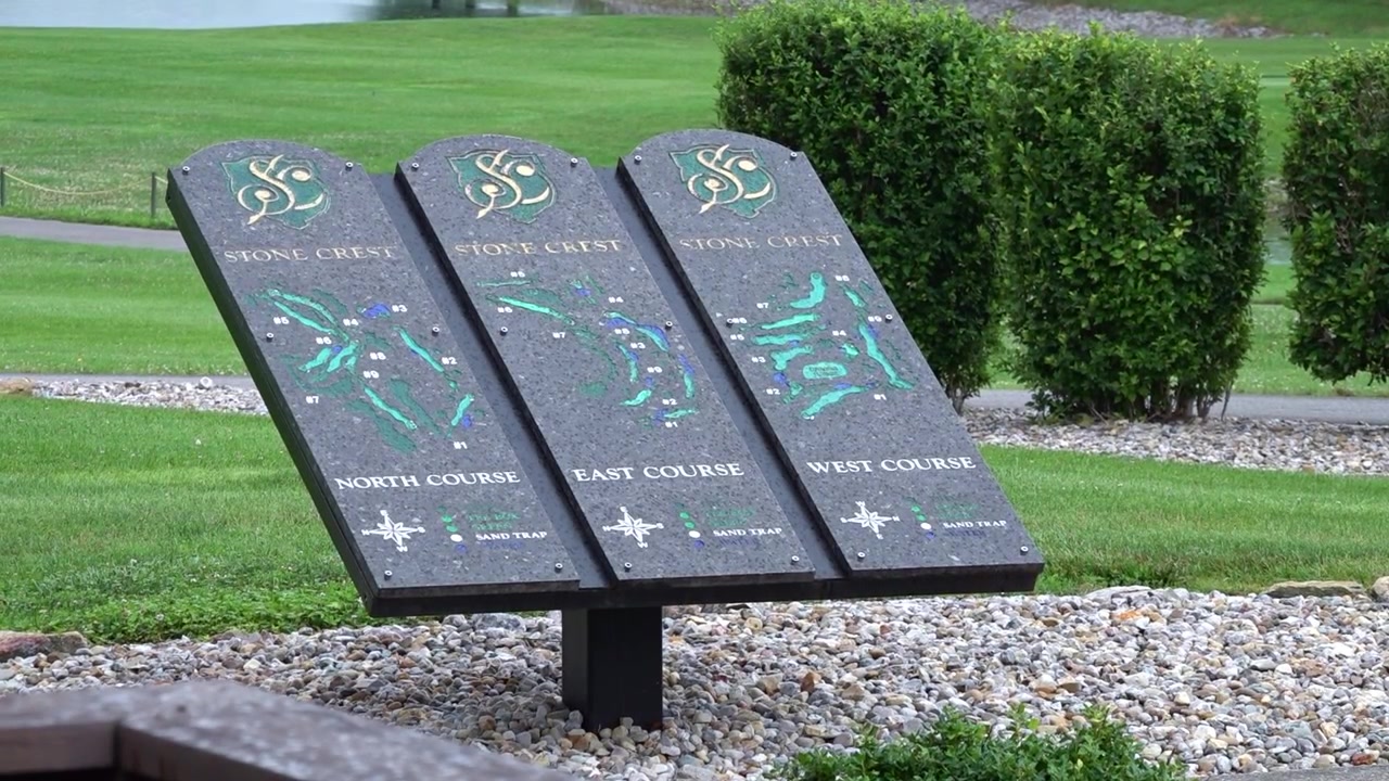 Close-up of a golf course map showing the layout of holes and course directions.