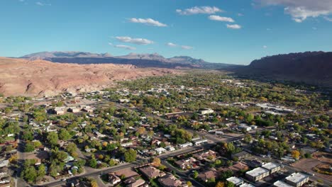 drone shot flying over moab, utah in the summer on a sunny day