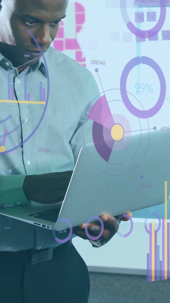 Vertical video: Male analyst tapping laptop keyboard, generating animated charts for data analysis