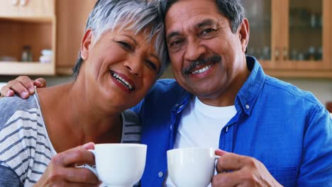 Senior-couple-having-coffee-at-home-4k
