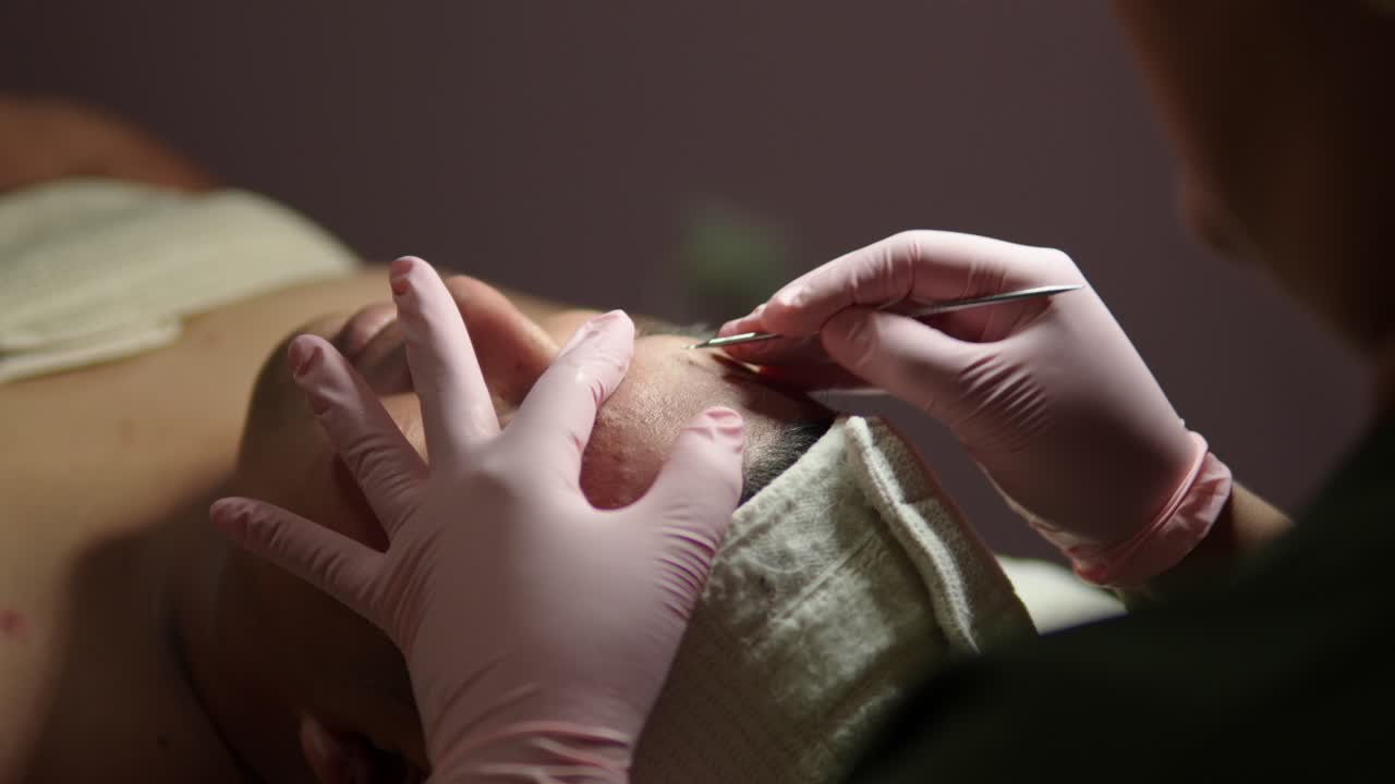 latin mexican spa day guy male forehead cleaning process treatment routine skin care pimple deep cleaning with ring light