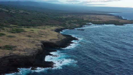 Low-aerial-close-up-shot-of-an-ancient-Mauna-Loa-lava-flow-along-the-southern-tip-of-the-Big-Island-of-Hawai'i