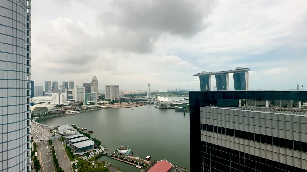 Time lapse overlooking the Marina Bay area onto Esplanade and Merlion in Singapore