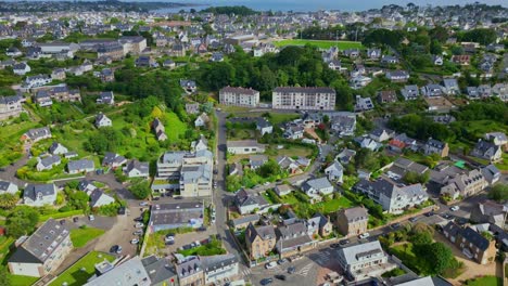 Amazing panorama drone shot if residential district of Perros-Guirec with tree-lined streets and homes, Brittany, France.